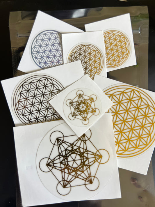 Sacred Ritual Oils Scalar Energetic Patches with geometric flower of life designs in gold and black