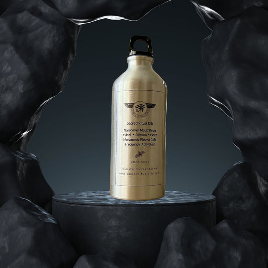 Sacred Ritual Oils gold bottle of colloidal silver for oral health on black rock background