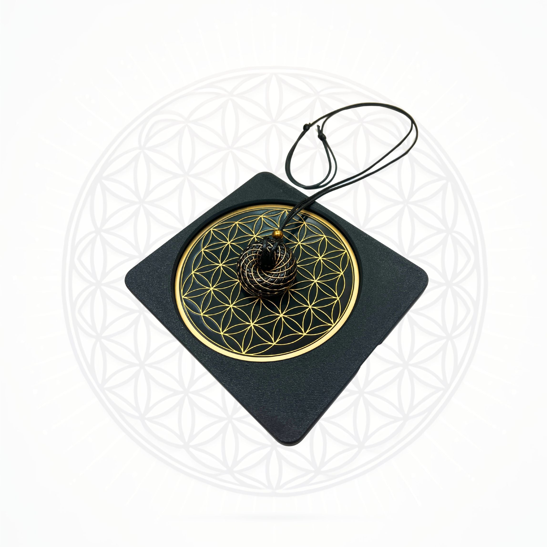 Sacred Ritual Oils Metatronic Flower of Life Frequency Imprinter with black pendant on gold geometric design