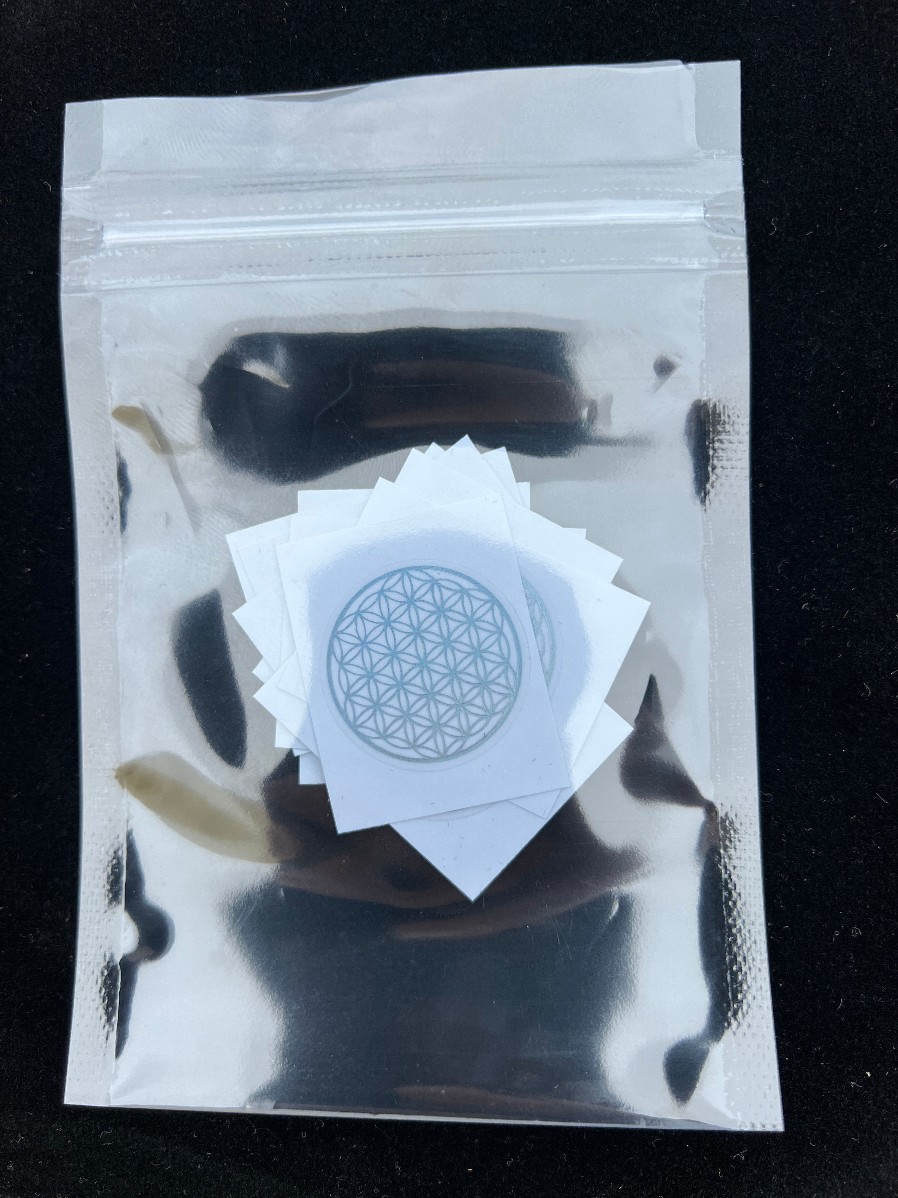 Sacred Flower of Life patches by Sacred Ritual Oils in a resealable silver pouch