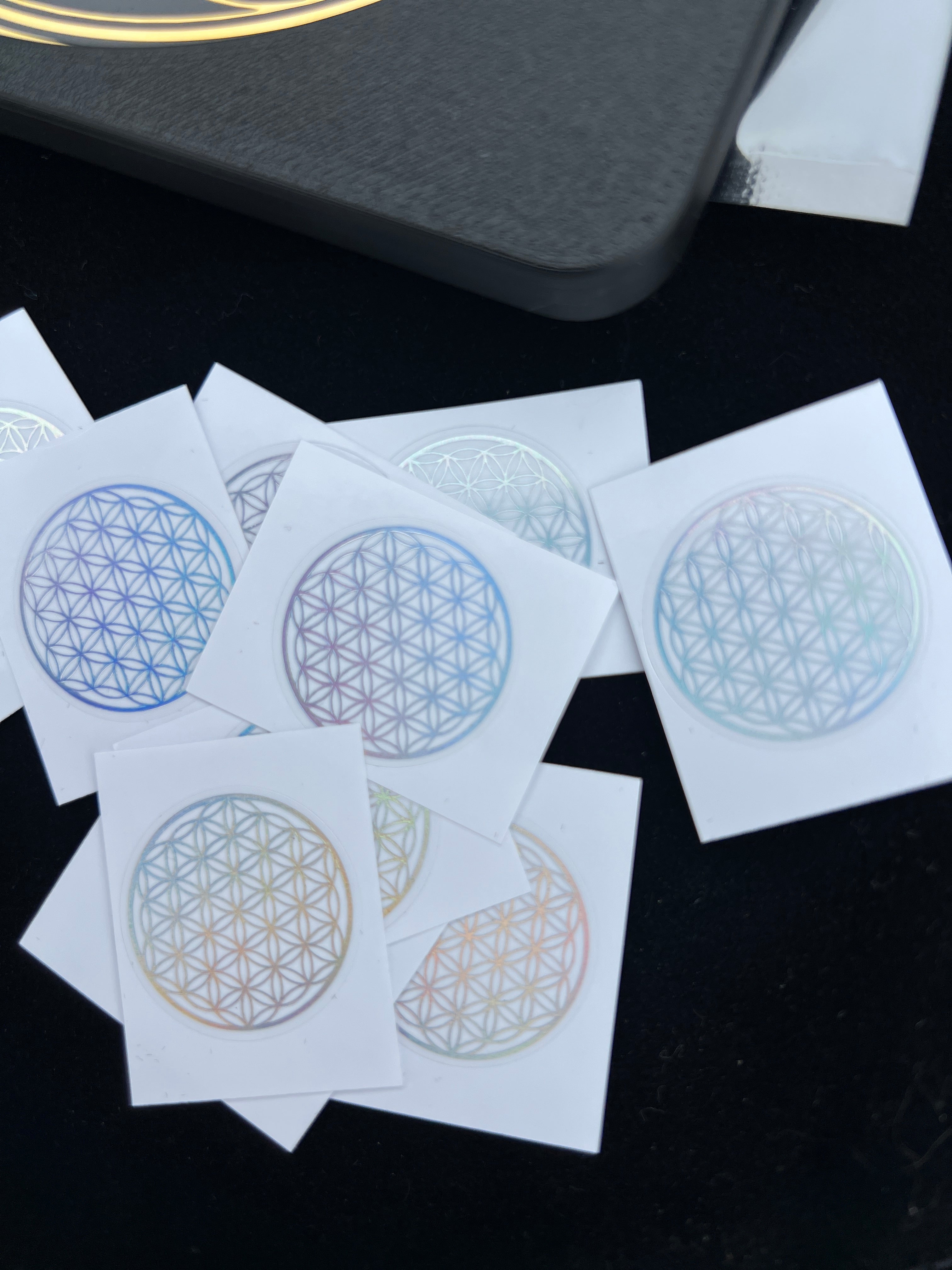 Sacred Flower of Life patches by Sacred Ritual Oils in various colors on white backing cards